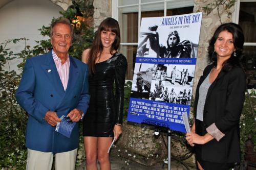Pat Boone by our hostesses with our movie poster